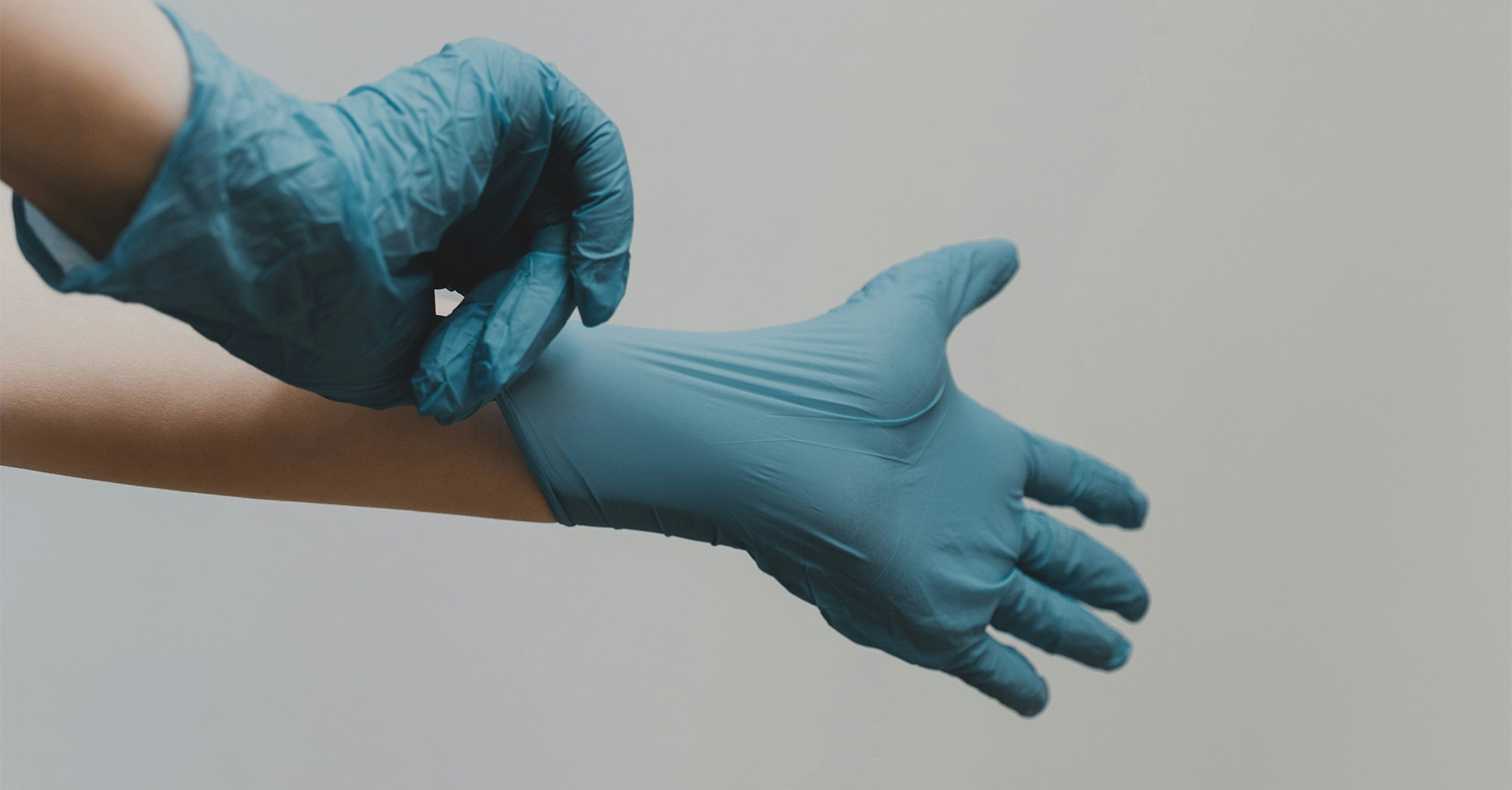 person with latex gloves